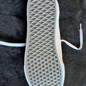 Vans men’s white shoes.